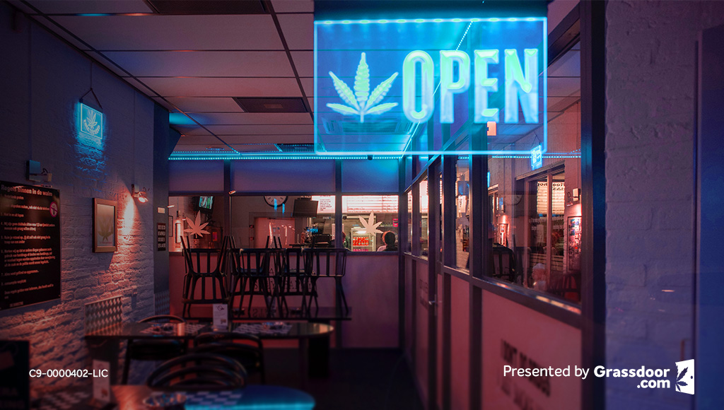 Cannabis restaurant with neon open sign with weed logo